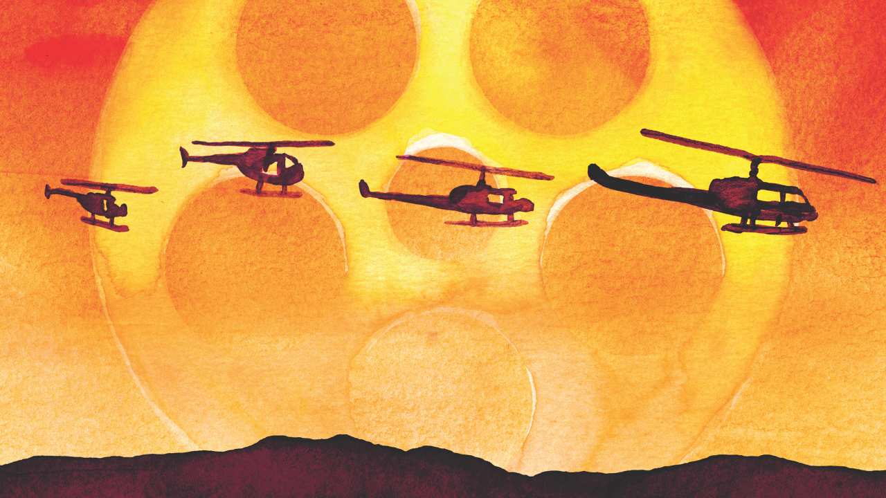 helicopters flying in front of a film reel sun